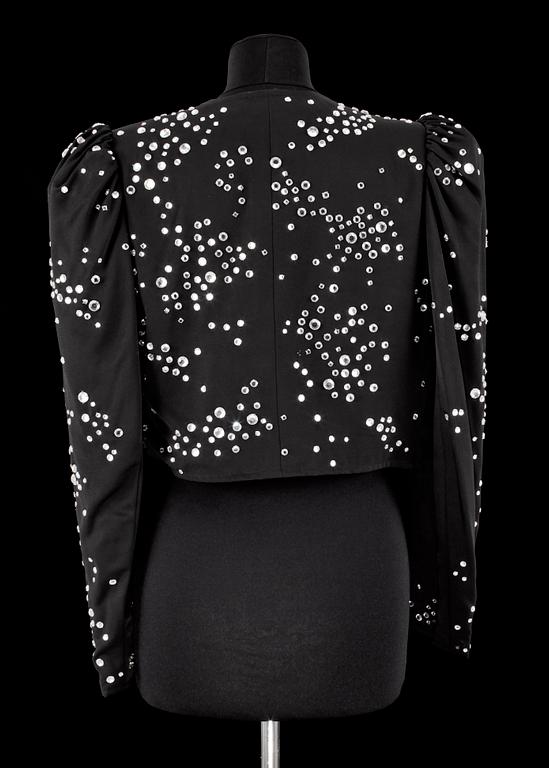 A black bolero by Yves Saint Laurent.