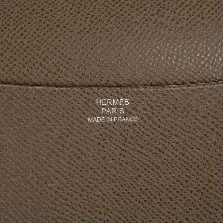 HERMÈS, a grey leather agenda cover, "Globe Trotter".