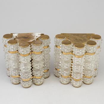 A pair of 1970's glass and brass wall lamps.