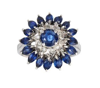 580. RING, set with blue sapphires and diamonds.