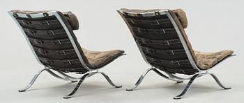 A pair of Arne Norell "Ari" black leather and steel easy chairs by Norell Möbel AB, probably 1960-70's.