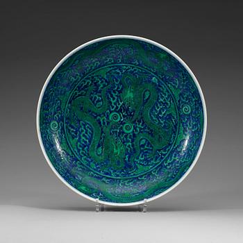 323. A large green enamelled blue and white dragon dish, Qing dynasty with Kangxi's six character mark.