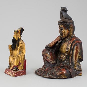 A pair of lacquered wooden deities, late 19th Century.