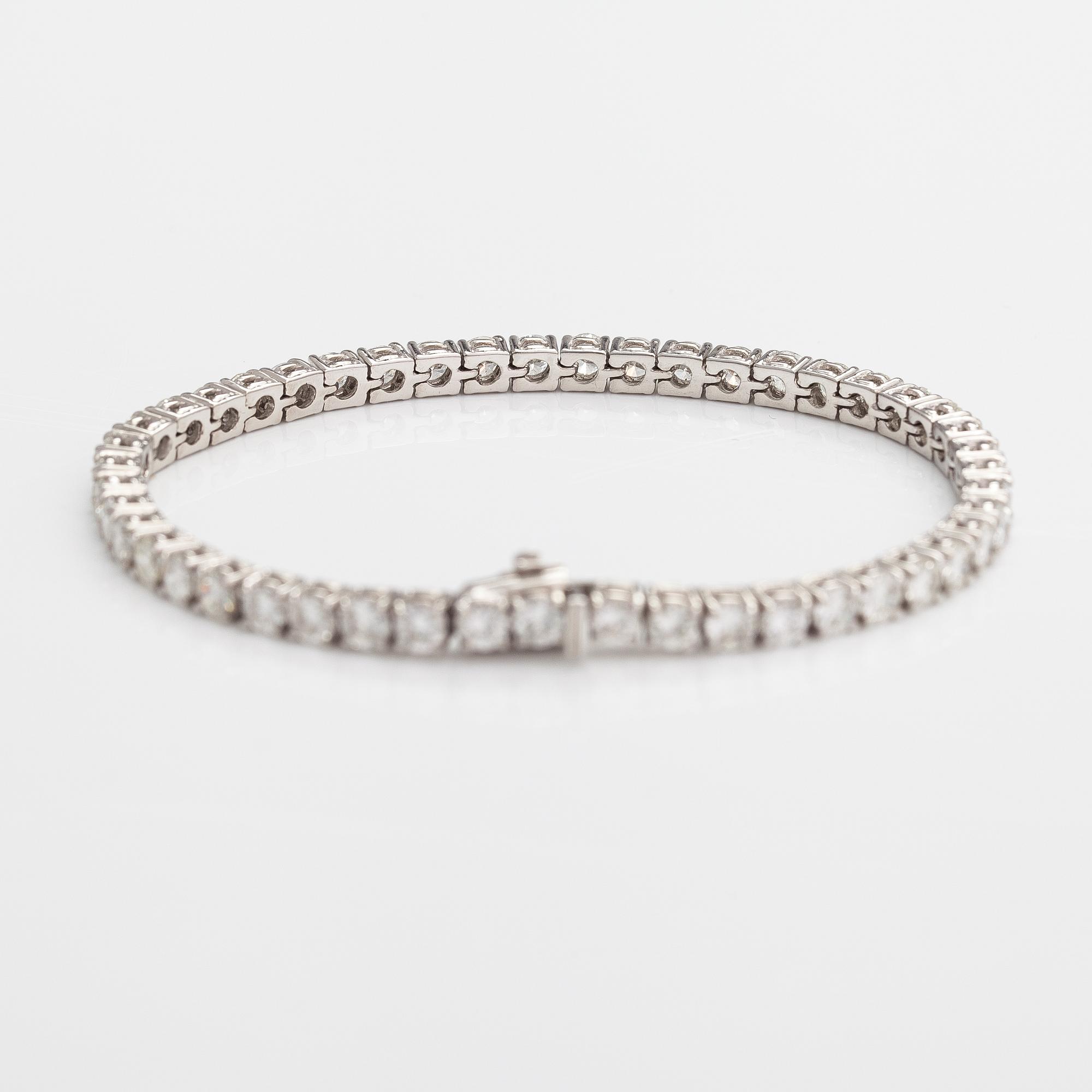 Tennisrannekoru, 18K valkokultaa, briljanttihiottuja timantteja n. 7.00 ct yht.