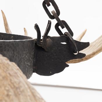 A moose horn and cast iron chandelier from around 1900.