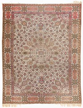 A Tabriz carpet, c. 390 x 305 cm.