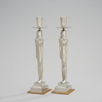 A pair of Edvin Öhrström 'Egyptian' pewter candlesticks, Svenskt Tenn, Stockholm 2001.