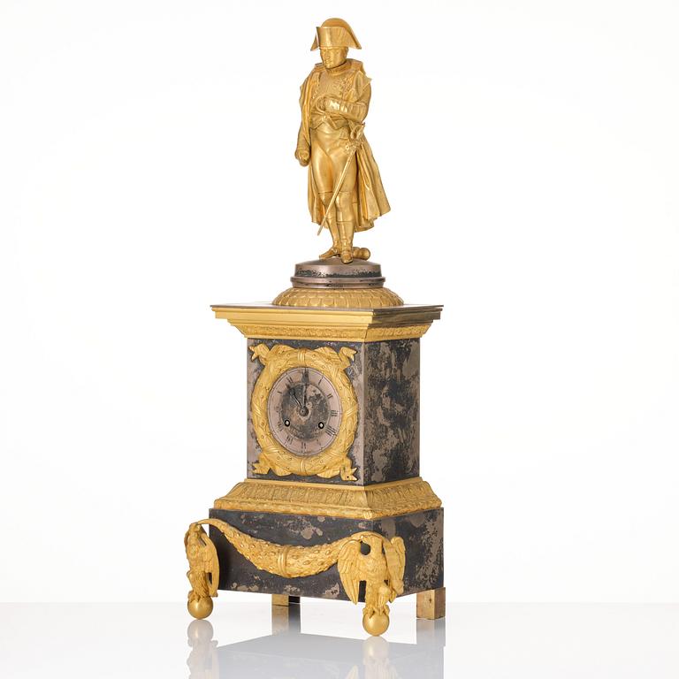 A French Empire ormolu and silvered bronze figural mantel clock, first part of the 19th century.