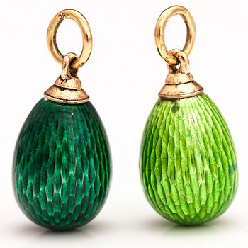 Two 14K gold pendants with enamel.