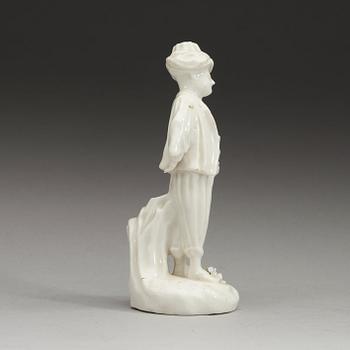 A Swedish Marieberg soft paste figure of a boy clad in Turkish garments, 18th Century.