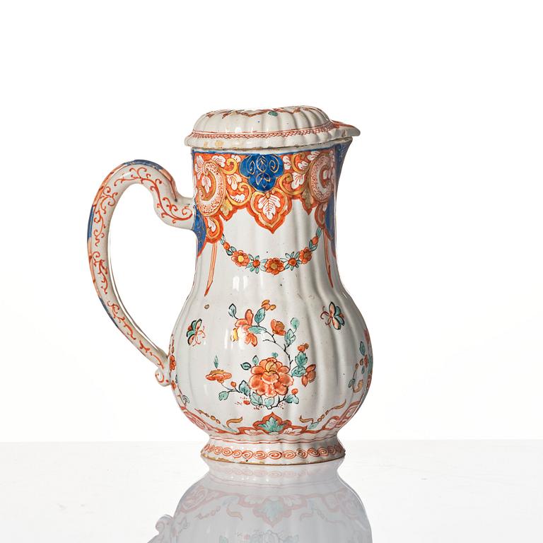 A Dutch Delft polychrome faience ewer, early 18th Century.