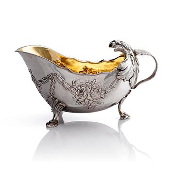 287. A Swedish Rococo 18th century parcel-gilt silver cream-jug, mark of Jacob Lampa, Stockholm 1774.