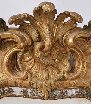 A Swedish giltwood and polychrome-painted Rococo mirror, later part of the 18th century.