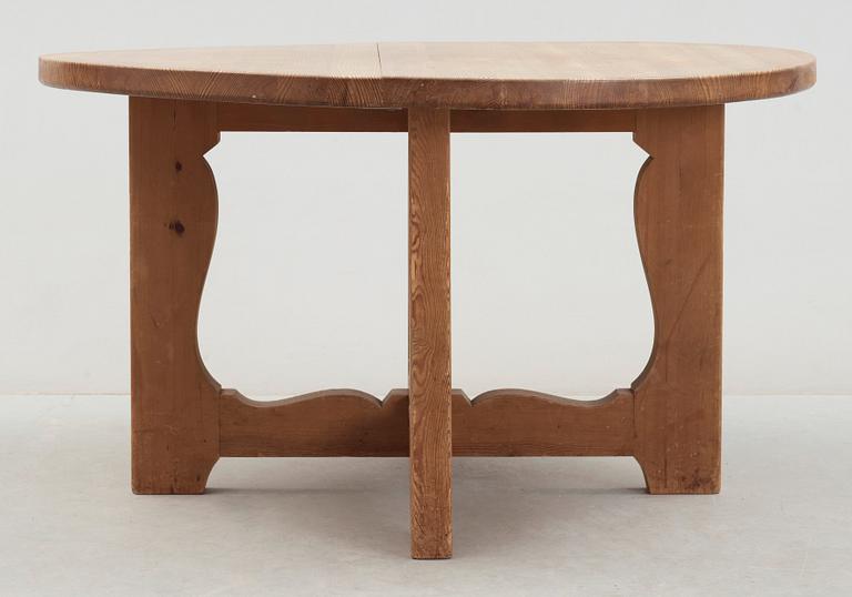 A stained pine dining table, attributed to Axel Einar Hjorth, Nordiska Kompaniet, 1930's.