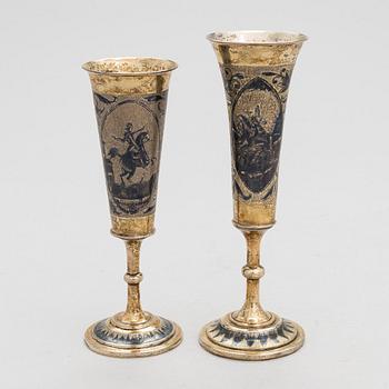 Two gilt silver and niello champagne flutes, Moscow 1842 and 1844. Unidentified maker's mark AK.