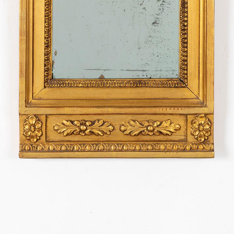 A giltwood Empire mirror by J. P. Holmberg (active in Stockholm 1813 - 1831).