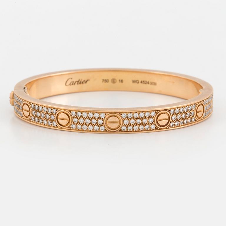 A Cartier 'LOVE' bangle set with round, brilliant-cut diamonds.