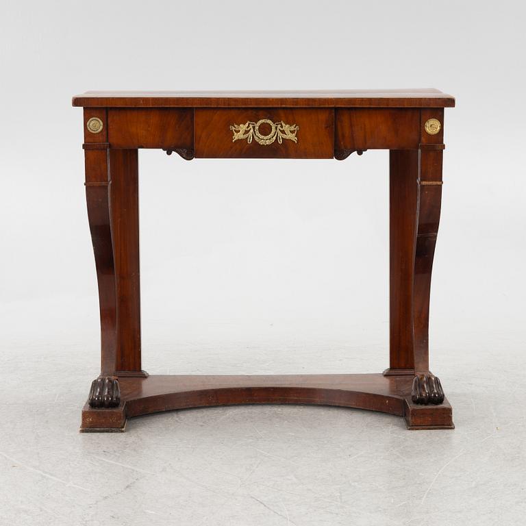 An empire console table, firts half of the 19th century.