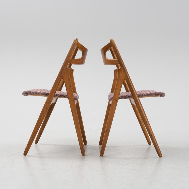 A set of six model CH 29 'Savbukstolen' by Hans J Wegner, designed 1952.