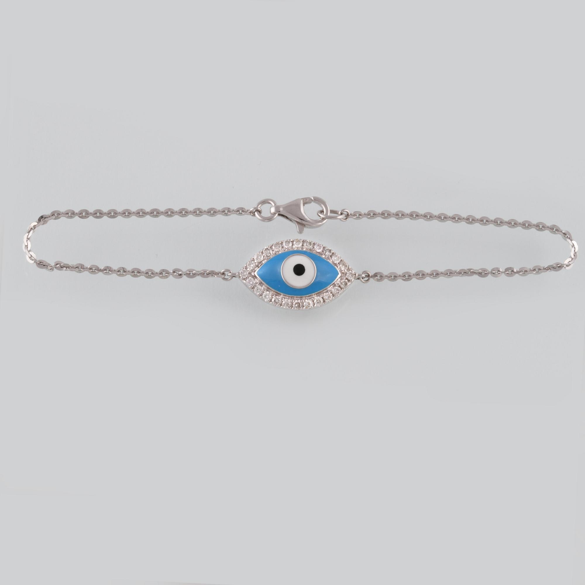 ARMBAND, 18K vitguld med briljantslipade diamanter ca 0.22 ct samt emalj. Vikt 2,8 gram.