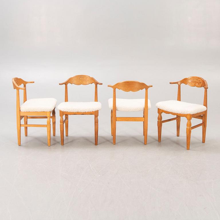 A set of 14 Henning Kjaerulf 1950s oak chairs.