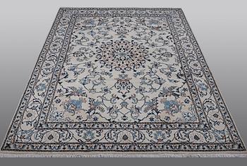 A rug, Nain, part silk, 238 x 163 cm.