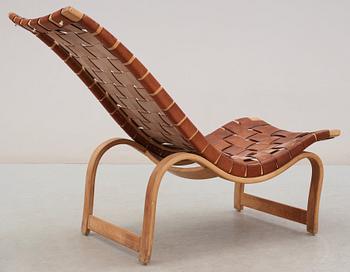 A Bruno Mathsson birch and brown leather lounge chair, model 36, Karl Mathsson, Värnamo 1939.