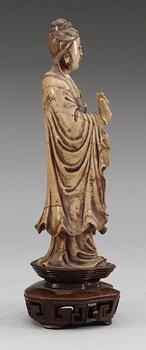 A stone sculpture of Guanyin, Qing dynasty (1644-1912).