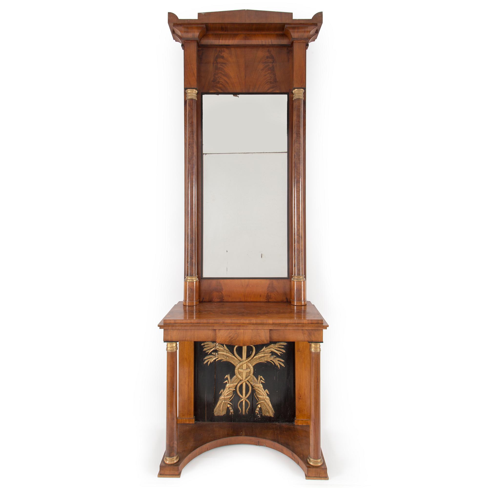 A swedish empire mirror and console table. First half of the 19th century.