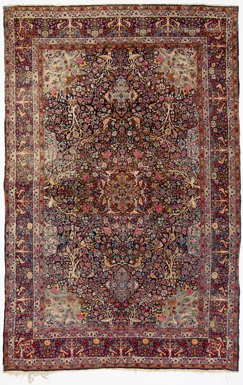 A carpet, Antique/semi-antique Kerman, ca 340 x 220 cm.
