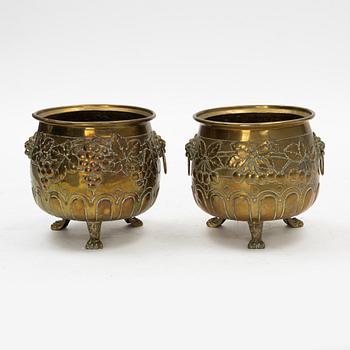 A pair of Baroque style brass plant pots, late 19th Century.