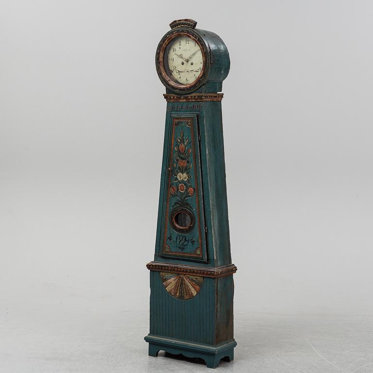 A painted grandfather clock, dated 1829.