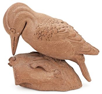 546. A Tyra Lundgren stoneware wood-pecker, signed with a seal.