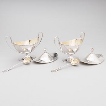 A pair of lidded silver sugar bowls with sprinkle spoons, mark of The Firm Carl Fredrik Carlman, Stockholm 1928-29.