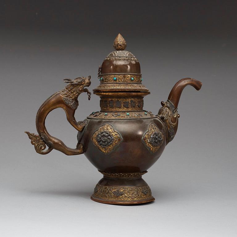 An copper alloy teapot with silver inlays, Tibet 19th Century.