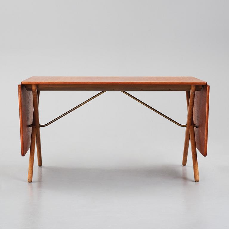 Hans J. Wegner, a teak and oak drop-leaf dining table, Andreas Tuck, Denmark 1950s-1960s.