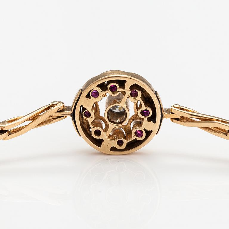 Armband, 14K guld, rubiner, diamant ca 0.11 ct.