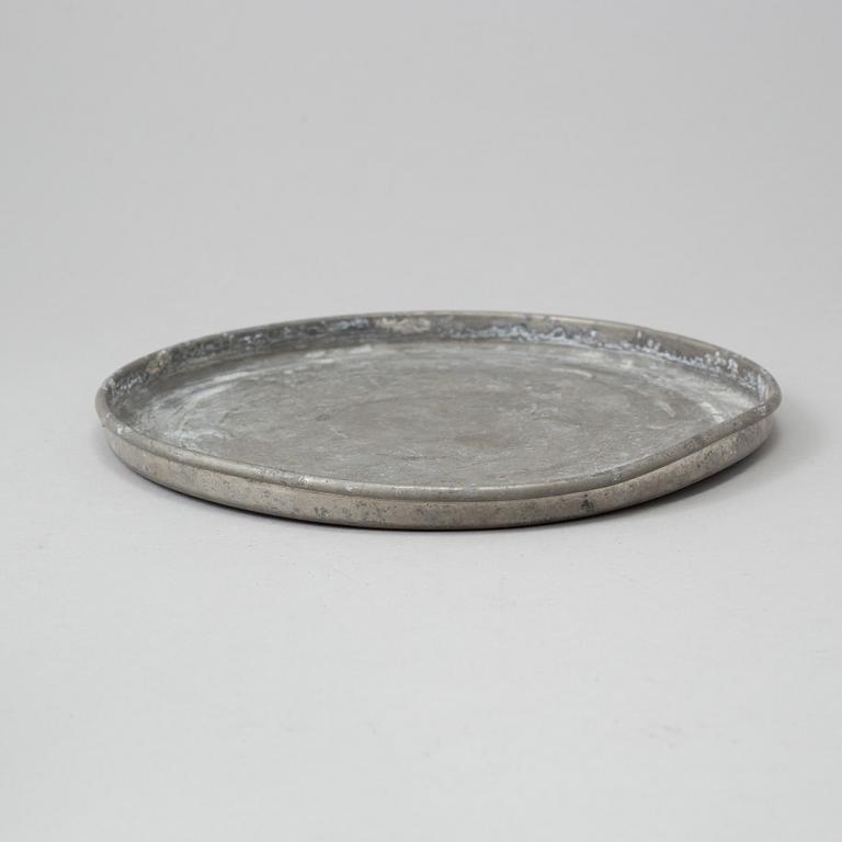 A pewter serving tray mark of FIRMA SVENSKT TENN, Stockholm, 1928.