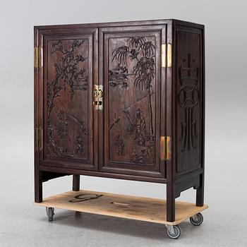 A hardwood cabinet, China, 20th century.