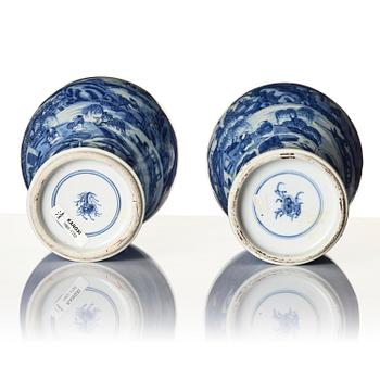 A pair of blue and white 'landscape' vases, Qing dynasty, Kangxi (1662-1722).