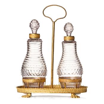 137. A Empire gilded brass and glass, cruet-set.