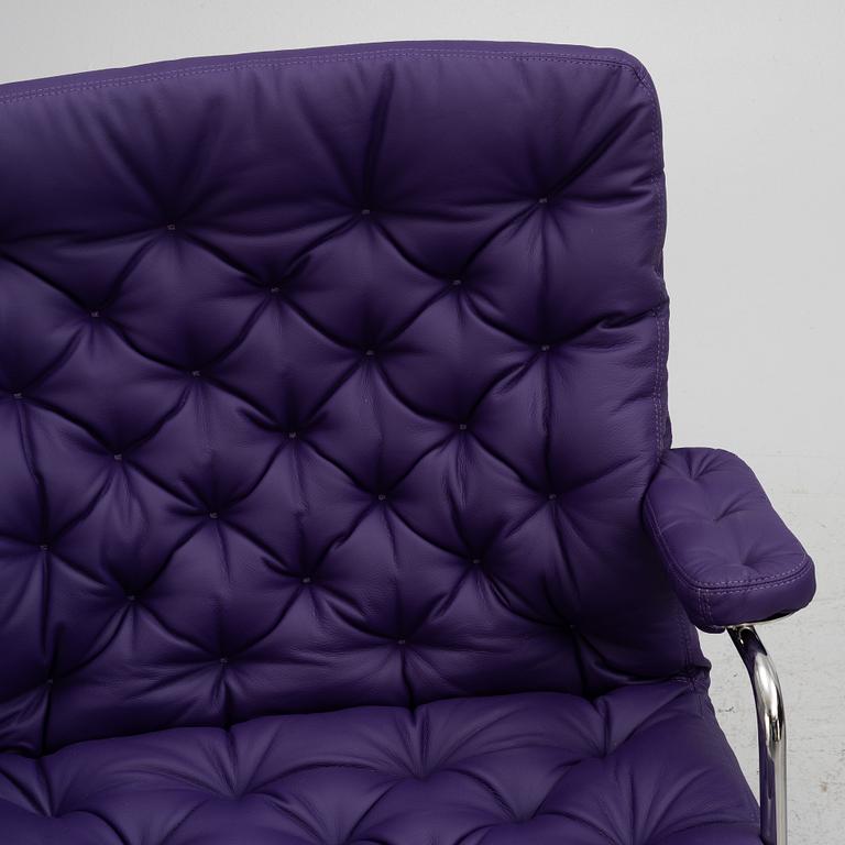 Bruno Mathsson, a limited edition of 'Karin 73' leather upholstered easy chair with footstool, from Dux, Released 2022.