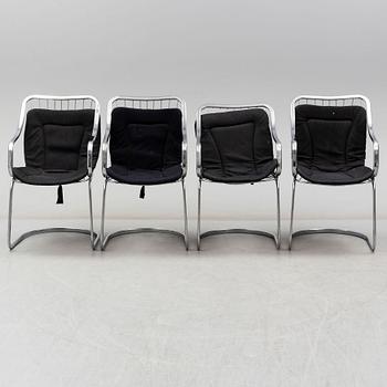 An Italian set of a glass table with four chromed metal chairs, 1970s.