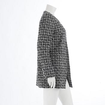CHANEL, ablack and white bouclé jacket, spring 2009.Size 40.
