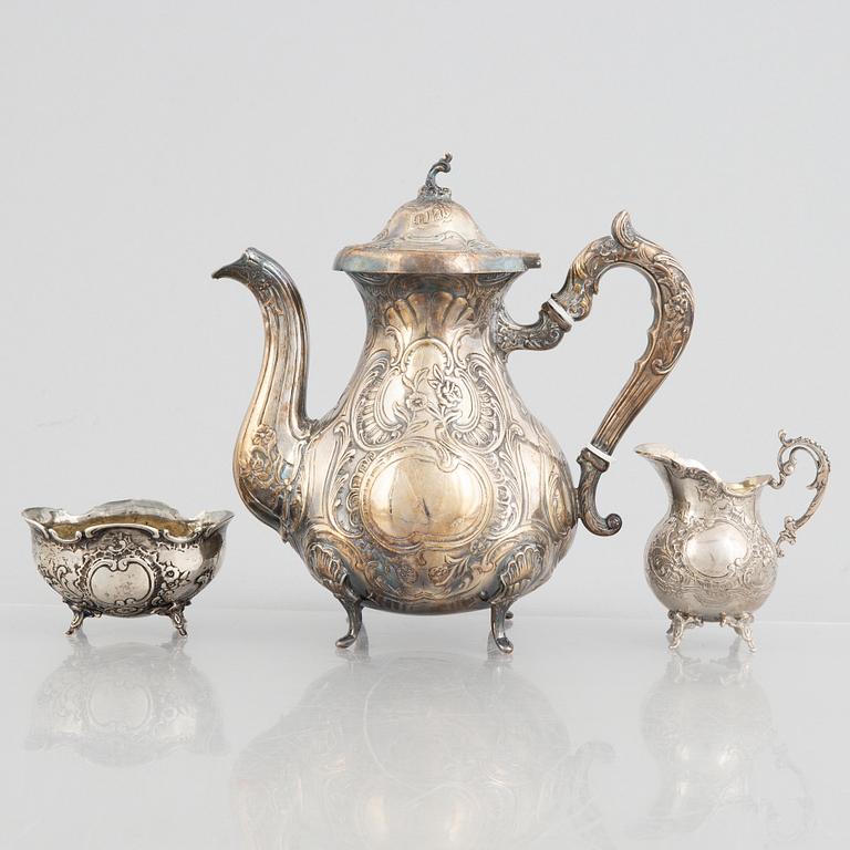 A silver coffee pot, creamer and sugar bowl, including GEWE, Malmö 1973. Rococo style.