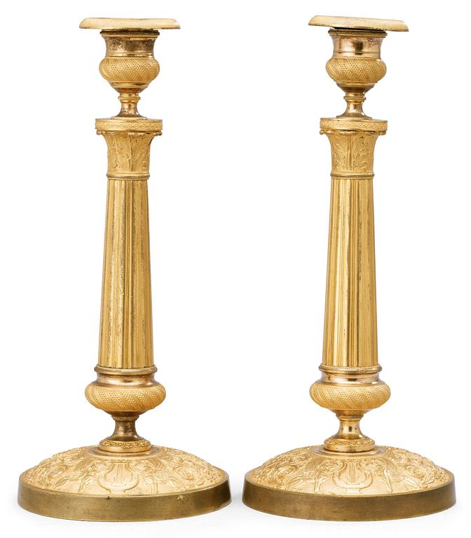 A pair of French Empire early 19th century candlesticks.