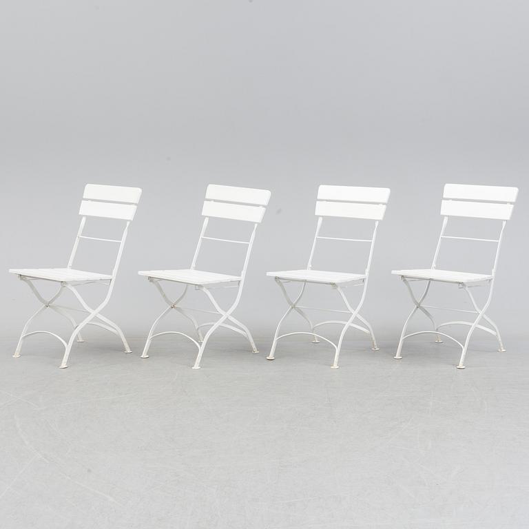 A Garden table with 4 chairs.