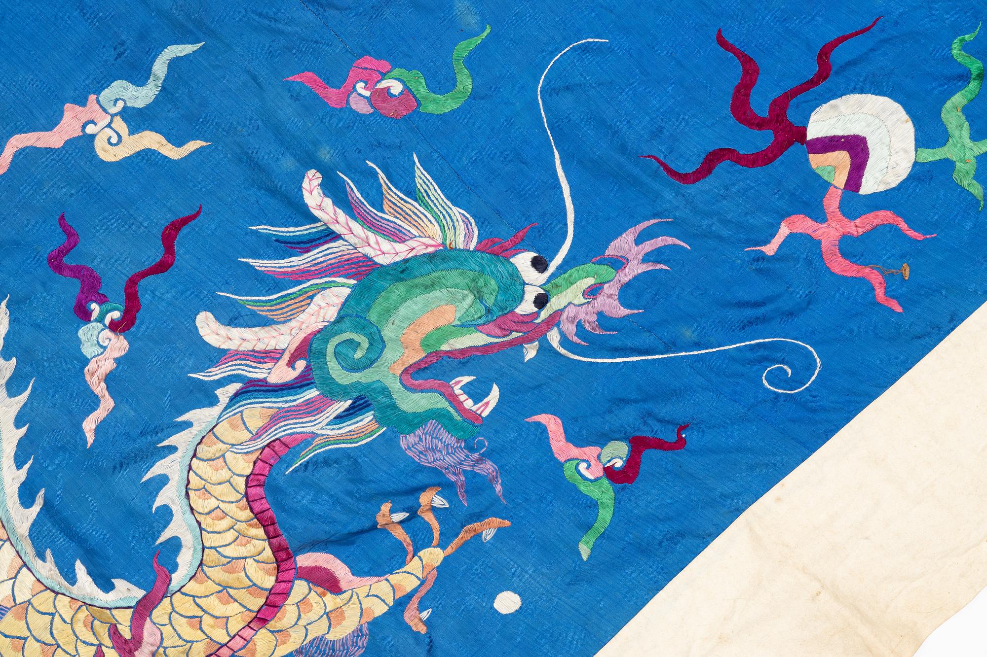 A Chinese embroidered triangular silk banner, late Qing dynasty/possibly early 20th century.