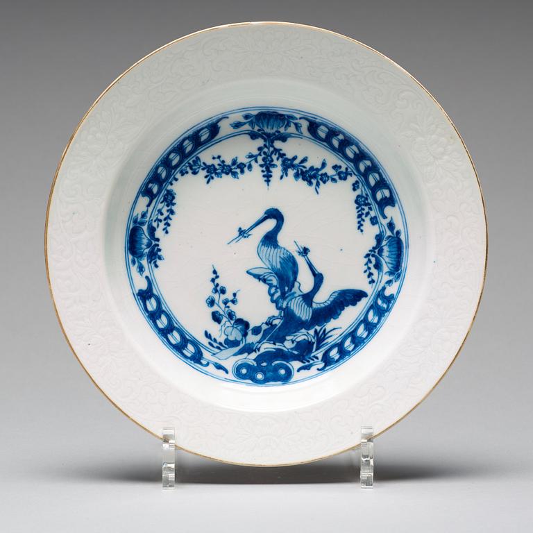 A set of eight blue and white armorial soup dishes, Qing dynasty, 18th Century.