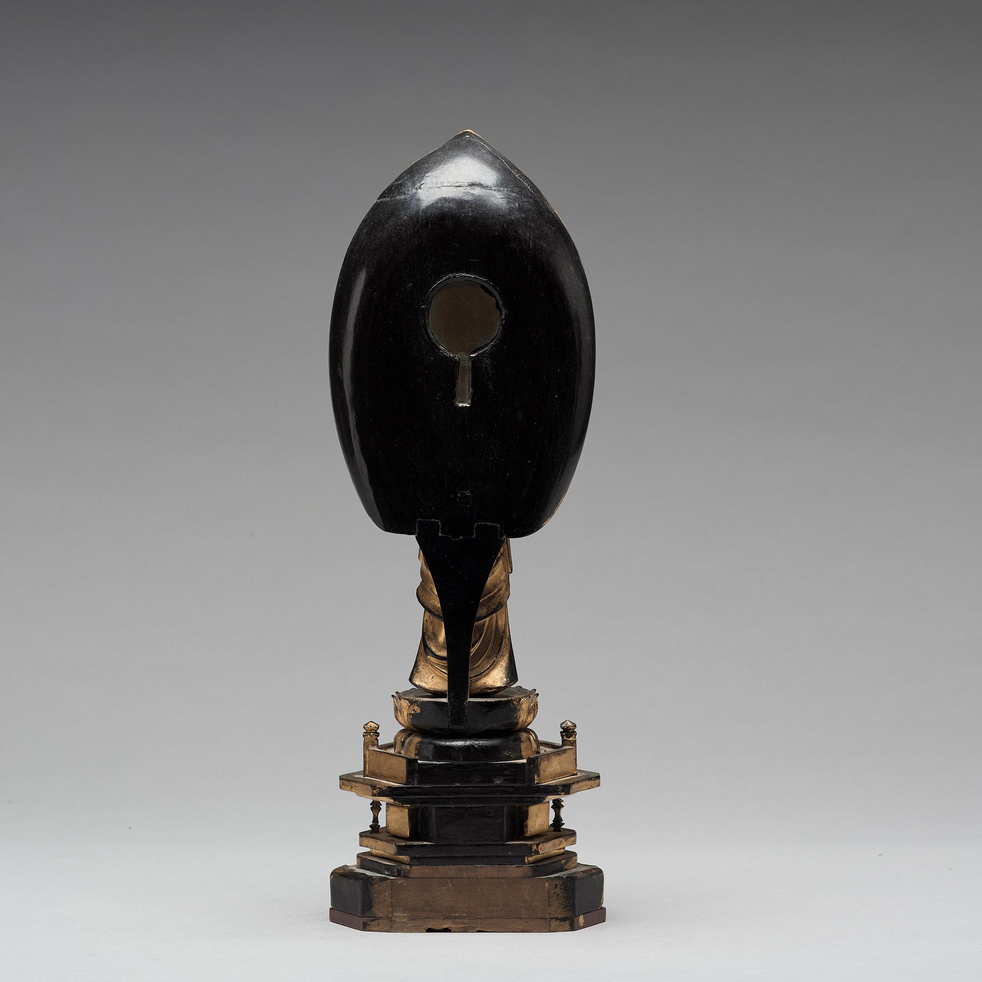 A Japanese gilt and lacquered wooden figure of Buddha and a travel shrine, Edo Period, 19th century.